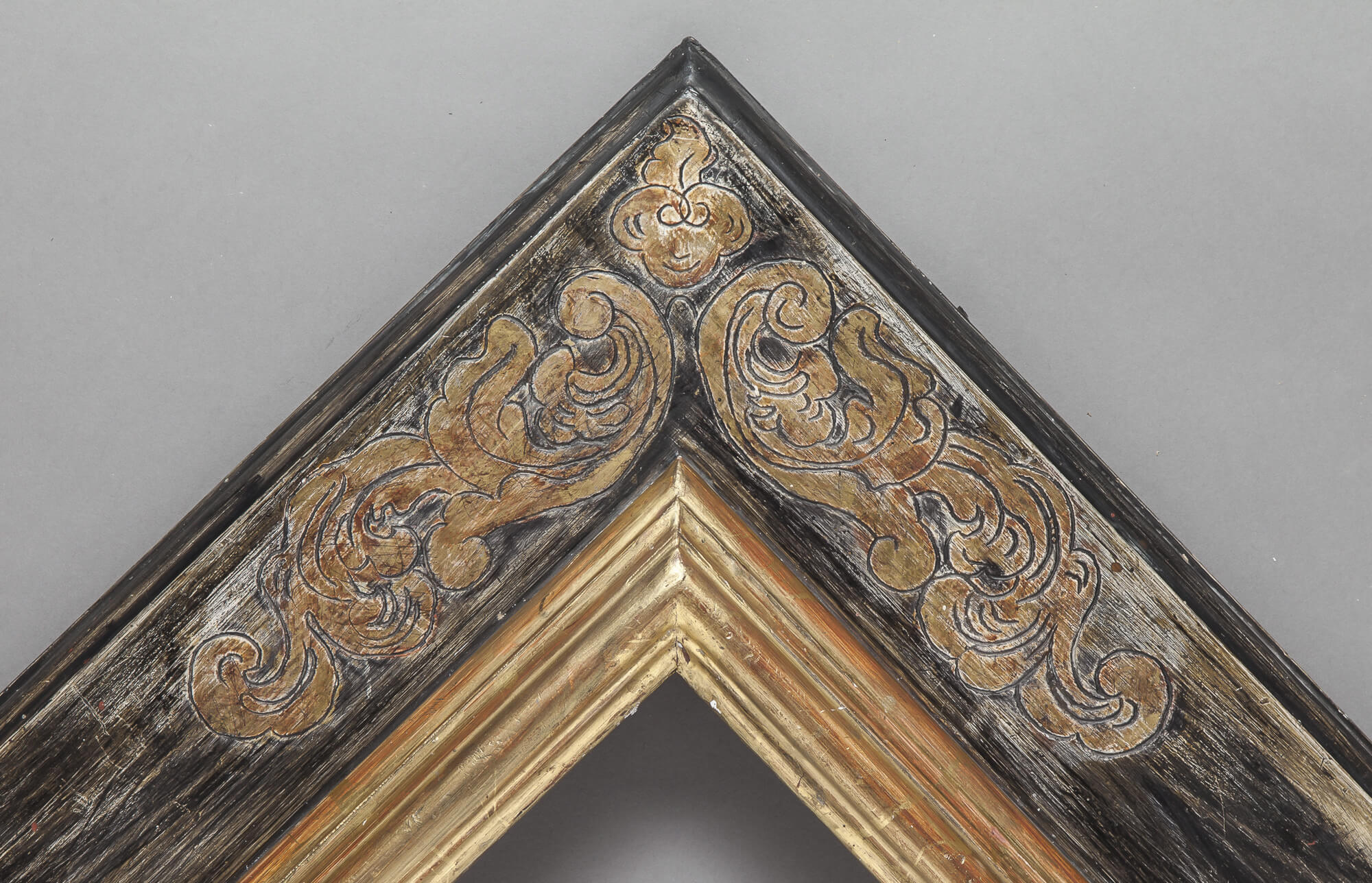 17th Century with engraved corner decorations.